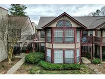 Charming townhome featuring a unique architectural design and inviting outdoor spaces at 703 Cypress Pointe St, Alpharetta, GA 30022