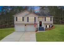 Charming split-level home featuring a two-car garage and a well-maintained lawn at 266 Carthage Blvd, Rockmart, GA 30153