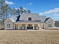 Charming single-Gathering home featuring a lovely front porch and rocking chairs on a spacious lot at 847 Cumberland Ave, Dallas, GA 30157