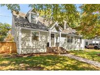 Charming two-story home with landscaped yard and inviting brick stairs to the front door at 1471 Hardin Ave, College Park, GA 30337
