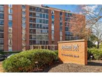 Brick condo building with large windows and a sign for Brookwood Park Condominiums at 130 26Th Nw St # 615, Atlanta, GA 30309