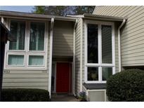 Inviting front entrance featuring a red door and large windows allowing for lots of natural light at 1932 Variations Ne Dr, Atlanta, GA 30329