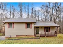 Charming single-story home featuring a welcoming front porch, siding, and traditional windows at 2211 Toonigh Rd, Canton, GA 30115