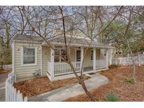 Charming single-story home with a welcoming front porch and well-maintained landscaping at 148 Murray Hill Ne Ave, Atlanta, GA 30317
