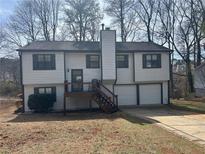 Charming two-story home with attached garage and well-maintained yard at 601 Brass Key Ct, Lawrenceville, GA 30046