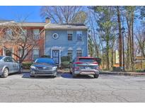 Two-story house featuring siding, multiple windows, and street parking at 1050 Wedgewood Ln, Tucker, GA 30084