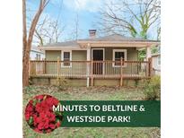 Charming single-story home with a covered front porch at 706 S Grand Nw Ave, Atlanta, GA 30318