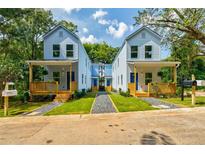 Charming blue two-story homes featuring inviting front porches and landscaped yards at 813 Smith Sw St # B, Atlanta, GA 30310