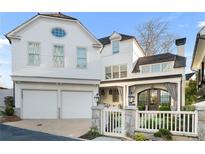 Stunning two-story home with a two-car garage and beautifully manicured front yard at 2500 Brook Run, Alpharetta, GA 30009