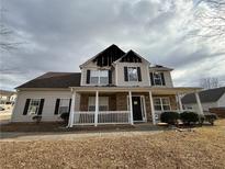 Two story home with covered porch; damaged by fire and in need of repairs at 952 Swan Ridge Cir, Grayson, GA 30017