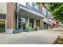 Viewpoint building entrance with planters and large windows in a thriving city center at 855 Peachtree Ne St # 2912, Atlanta, GA 30308