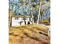 Charming single-Gathering home with a tidy front yard and mature trees in a quiet neighborhood at 512 Alpine Way, Marietta, GA 30062