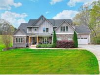 Beautiful two-story home featuring stone accents and a well-manicured lawn at 4539 Tiffany Ln, Loganville, GA 30052