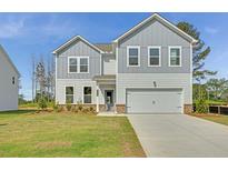Charming two-story home features a two-car garage, well-manicured lawn, and classic architectural design at 202 Groveton Ct, Euharlee, GA 30145