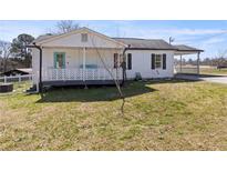 Charming single-story home with white siding and a cozy front porch at 3384 Nebo Rd, Dallas, GA 30157