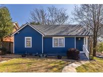 Charming blue bungalow with well-maintained lawn, walkway, and inviting front porch at 606 Glenwood Pl, Atlanta, GA 30316