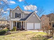 Charming two-story home featuring a two-car garage and a welcoming front porch at 4283 Hempstead Nw Ct, Kennesaw, GA 30144