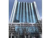 Modern high-rise building with glass facade and multiple balconies offering city views at 3324 Peachtree Ne Rd # 1116, Atlanta, GA 30326