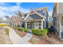 Charming two-story home with covered porch, manicured landscaping, and a welcoming front entrance at 196 Wingo St, Norcross, GA 30071