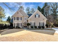 Charming two-story home with a well-manicured lawn and classic architectural details at 9290 Waits Ferry Xing, Duluth, GA 30097
