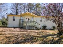 Charming single story home with a cozy porch and decorative accents at 1640 Trails Way, Marietta, GA 30066