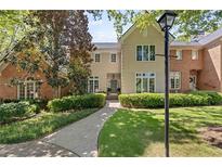 Charming home featuring manicured landscaping and a walkway leading to the front door at 15 Paces West Nw Dr, Atlanta, GA 30327