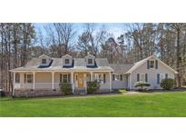 Charming ranch-style home with a welcoming front porch and well-maintained lawn at 250 Felton Dr, Fayetteville, GA 30214