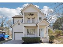 Charming two-story home featuring a double porch and light blue front door at 260 Westview Sw Pl, Atlanta, GA 30314