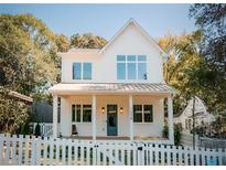 Charming two-story home featuring a classic white picket fence and inviting front porch at 185 Marion # A, Atlanta, GA 30307