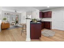 Open kitchen and living area with stainless appliances and hardwood floors, bright and modern at 390 17Th Nw St # 1063, Atlanta, GA 30363