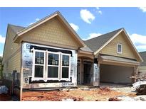 New construction showing the home's exterior with bright windows, siding and attached garage at 115 Laurel Farms Ln, Dallas, GA 30157