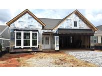 New construction home featuring a classic design and an attached two-car garage at 115 Laurel Farms Ln, Dallas, GA 30157