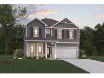 Charming two-story home featuring gray siding, black shutters, covered porch and a two car garage at 2614 Mourning Dove Drive (Lot 43), Grayson, GA 30017