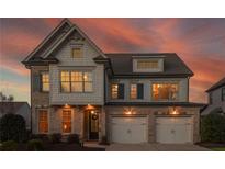 Beautiful two-story home with brick and shingle accents, a two-car garage, and a welcoming front entrance at 3910 Cameron Ct, Cumming, GA 30040