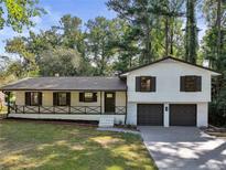 Charming two-story home with a well-maintained lawn and beautiful, neutral paint at 138 Regal Nw Way, Lawrenceville, GA 30044
