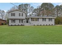 Charming two-story home with a well-manicured lawn and inviting curb appeal at 2017 Allwood Ct, Lawrenceville, GA 30044
