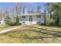 Charming single-Gathering home featuring a well-maintained lawn and a classic facade at 2288 Street Deville Ne, Atlanta, GA 30345