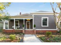 Charming craftsman home with a welcoming front porch and professionally landscaped front yard at 629 Hansell Se St, Atlanta, GA 30312