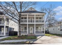 Charming two-story home with a welcoming front porch and classic architectural details at 970 Welch Sw St, Atlanta, GA 30310