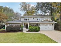 Charming two-story home with a manicured lawn and an attached two-car garage at 2262 Abby Ne Ln, Atlanta, GA 30345