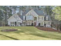 Stunning two-story traditional home with a lush lawn and mature trees at 125 Briar Meadow Ct, Fayetteville, GA 30215
