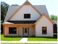 Charming new construction home with modern farmhouse design and well-manicured front lawn at 127 Old Alabama Road Se, Emerson, GA 30137