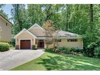 Charming single-Gathering home with a manicured lawn and a private driveway at 1233 Poplar Grove Ne Dr, Atlanta, GA 30306
