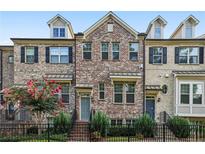 Charming brick townhome with a well-maintained front yard and a classic architectural design at 1829 Hislop Ln, Atlanta, GA 30345