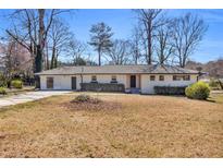 Charming one-story home with large front yard and inviting curb appeal at 2917 Mcafee Rd, Decatur, GA 30032