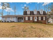 Charming two-story home with brick and siding and classic curb appeal at 4555 Cedar Heights Ct, Stone Mountain, GA 30083