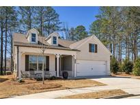 Charming single-Gathering home featuring a manicured lawn and a two-car garage, nestled in a tranquil neighborhood at 2537 Oak Barrel Dr, Snellville, GA 30078