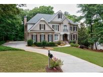 Well-maintained home with a manicured lawn, detailed landscaping, and a welcoming entrance at 5053 Chapel Xing, Douglasville, GA 30135