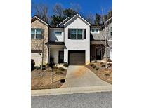 Charming townhome featuring a one-car garage and a well-maintained front yard at 3181 Meadowstone Ln, Atlanta, GA 30331