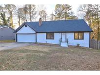 Charming one-story home featuring a freshly painted exterior, attached garage, and inviting front entrance at 3481 Oak Run Dr, Lithonia, GA 30038